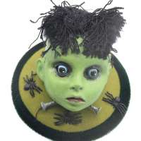 Herman Doll's head Halloween fascinator